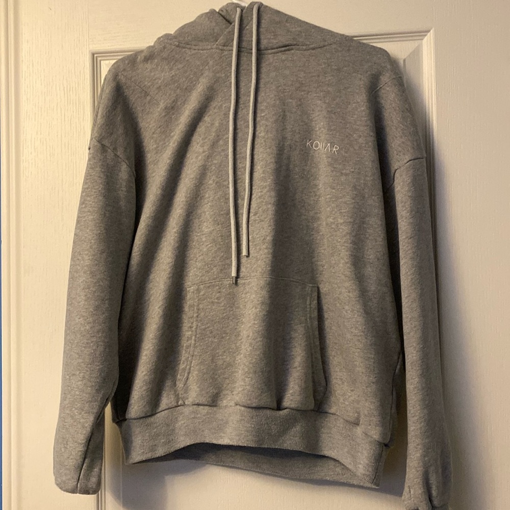Men’s plain grey hoodie with small logo on the front. Kollar clothing brand .